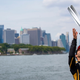 A photo of Antonio Felix da Costa throwing his New York trophy into the air.